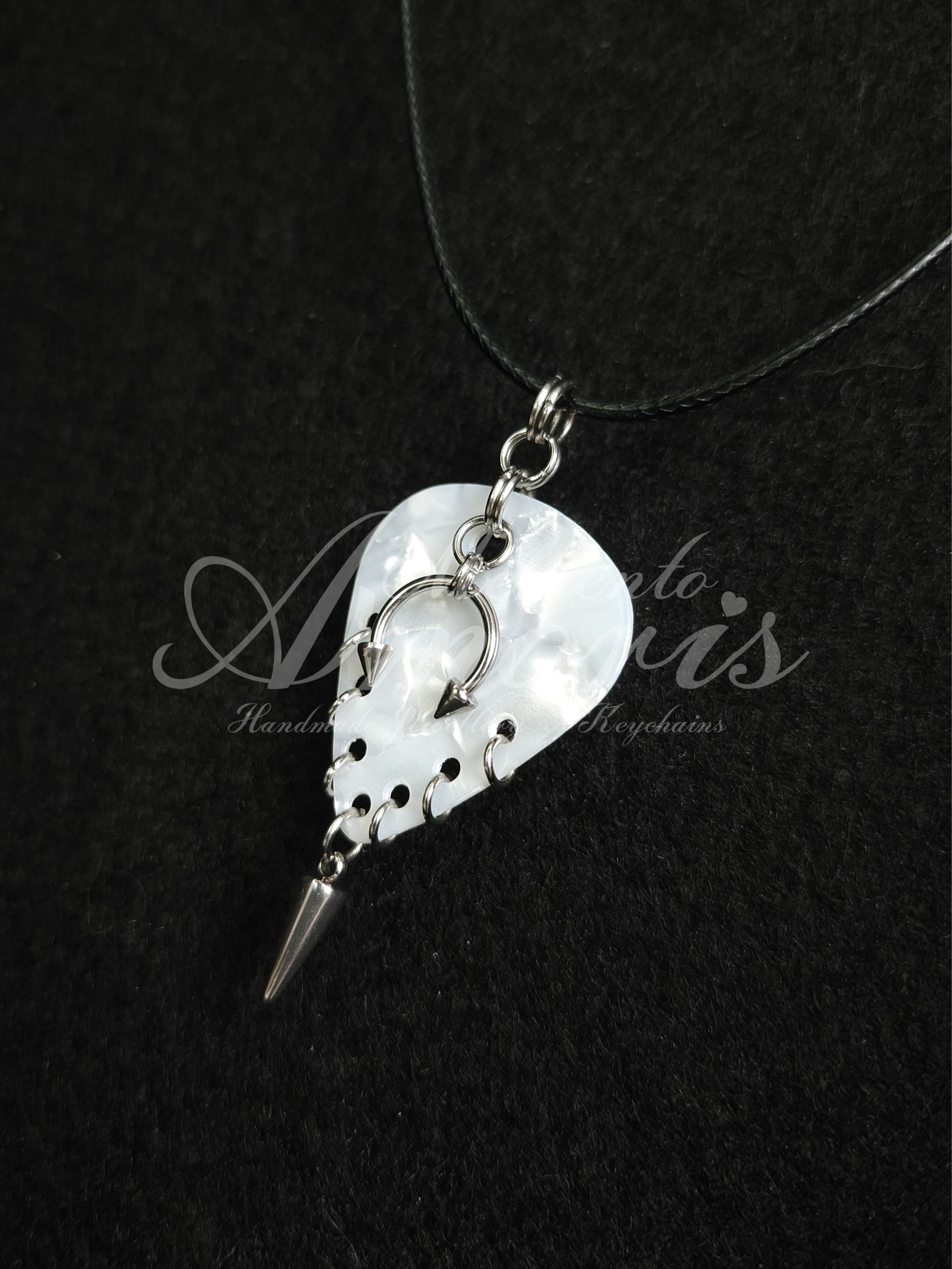 Plectrum Necklace 'Pierced and spiked' in white, silver