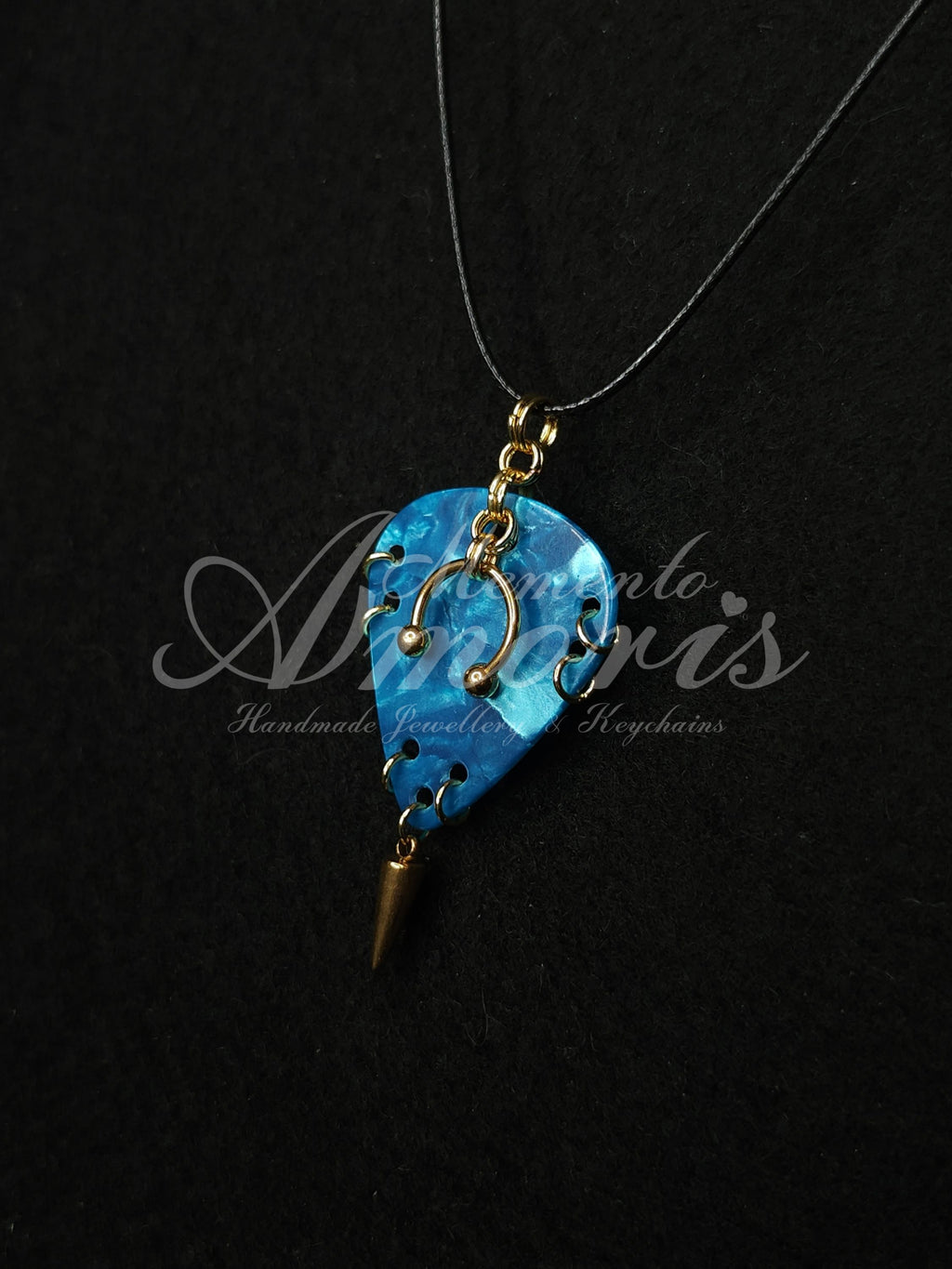 Plectrum Necklace 'Pierced and spiked' in blue, gold