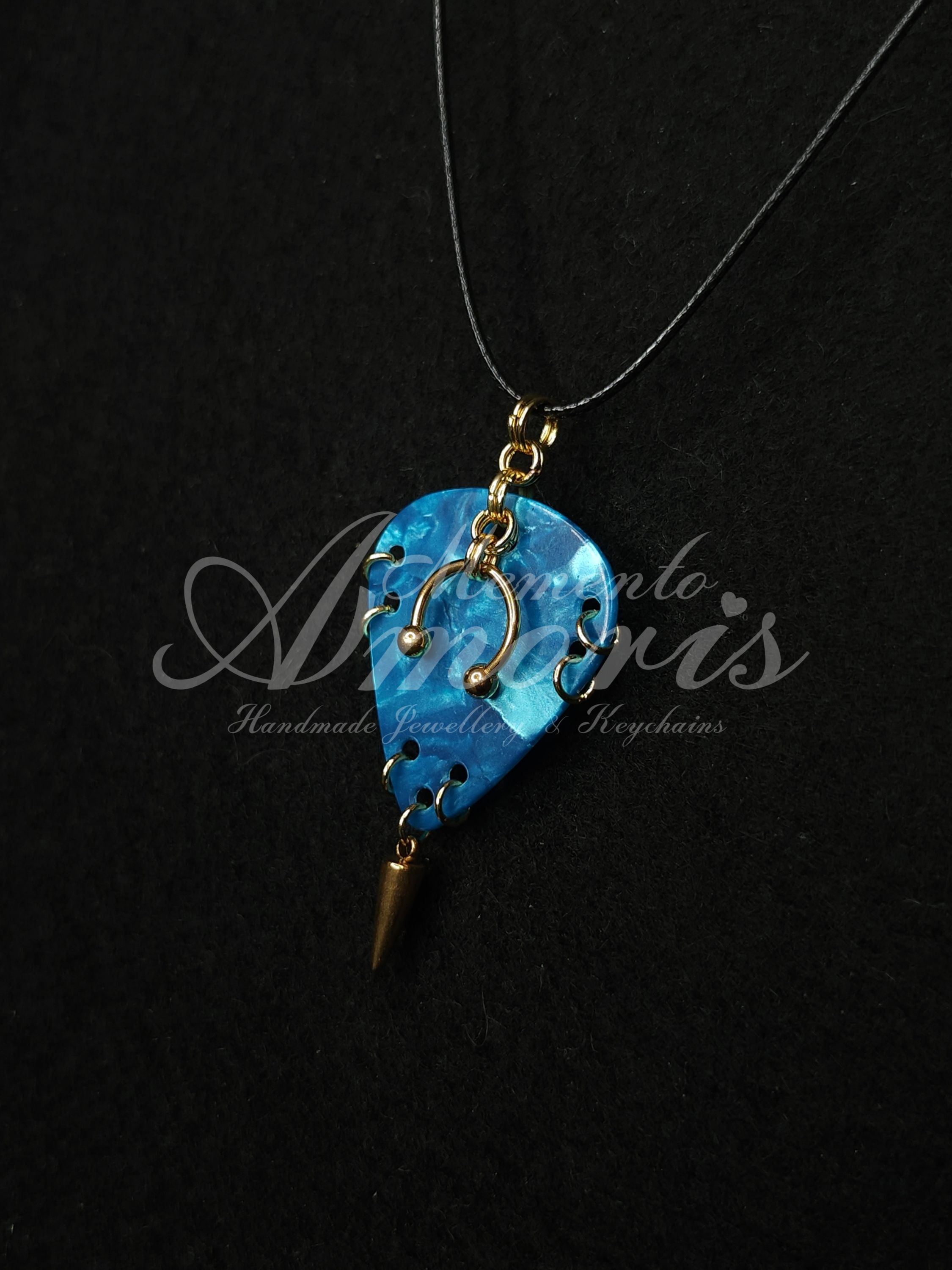 Plectrum Necklace 'Pierced and spiked' in blue, gold