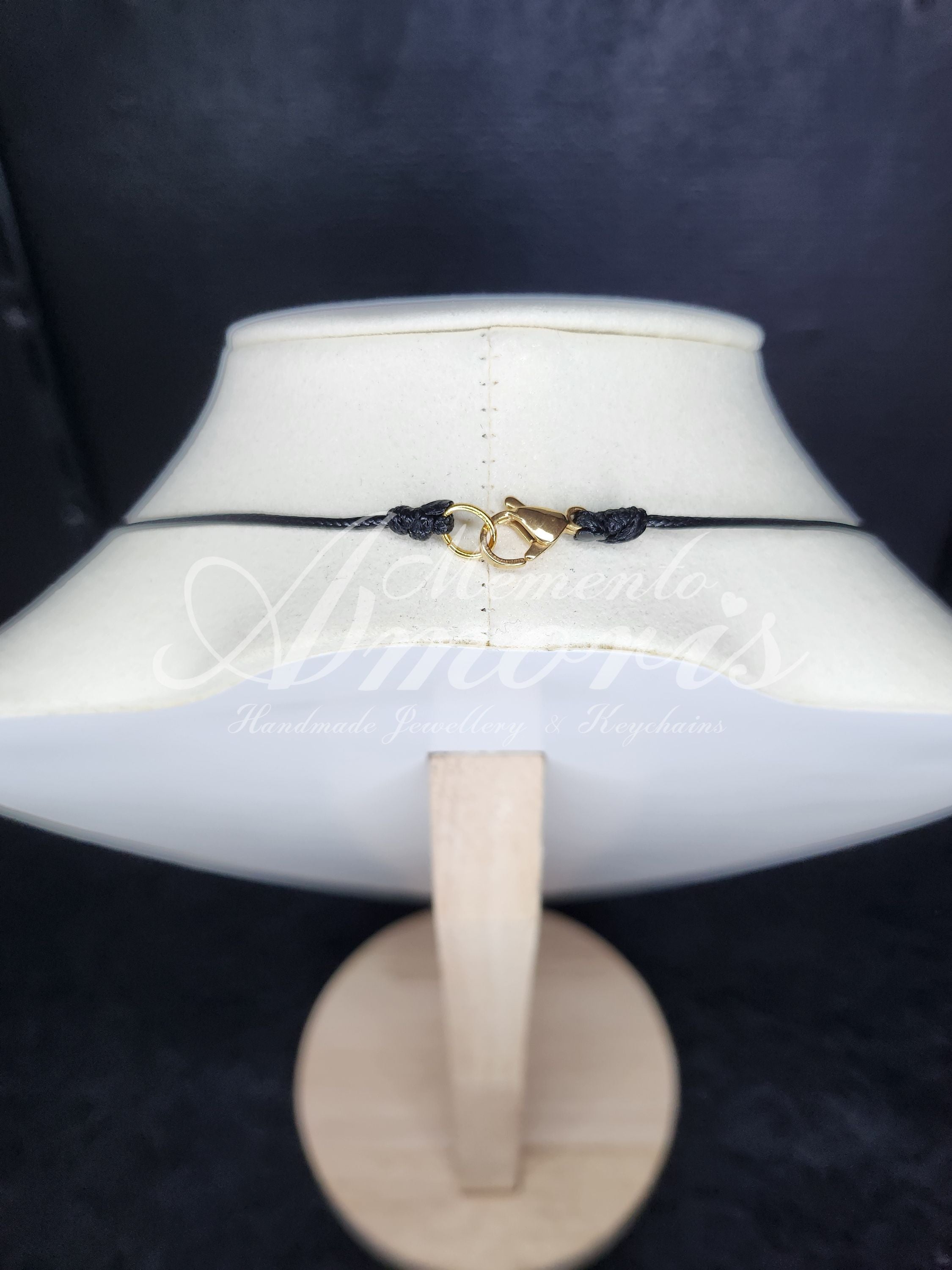Plectrum Necklace 'Pierced and spiked' in blue, gold