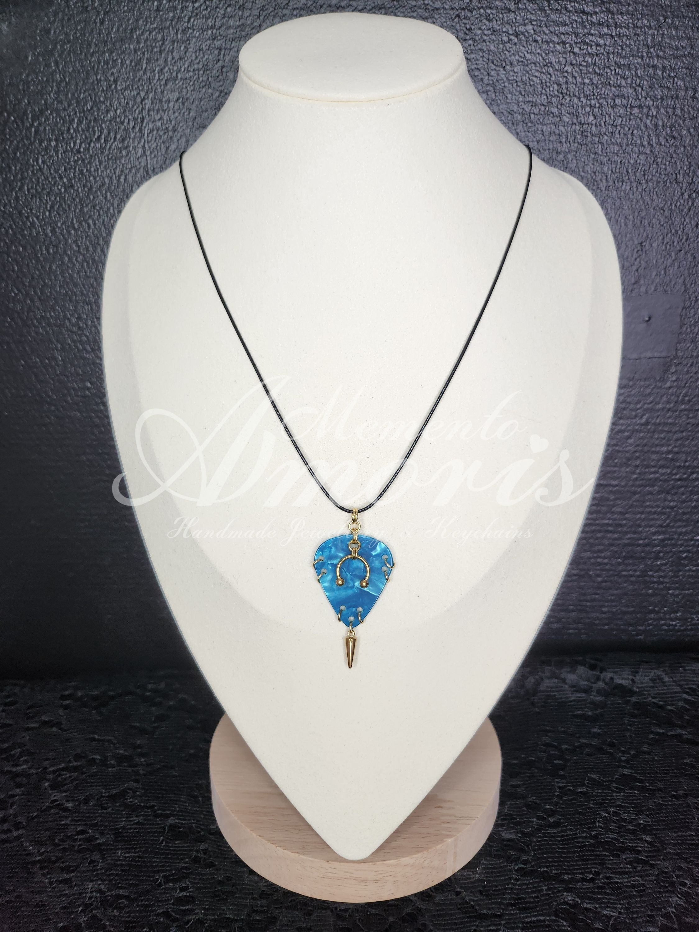 Plectrum Necklace 'Pierced and spiked' in blue, gold