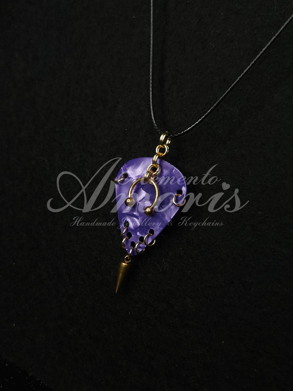 Plectrum Necklace 'Pierced and spiked' in purple, gold