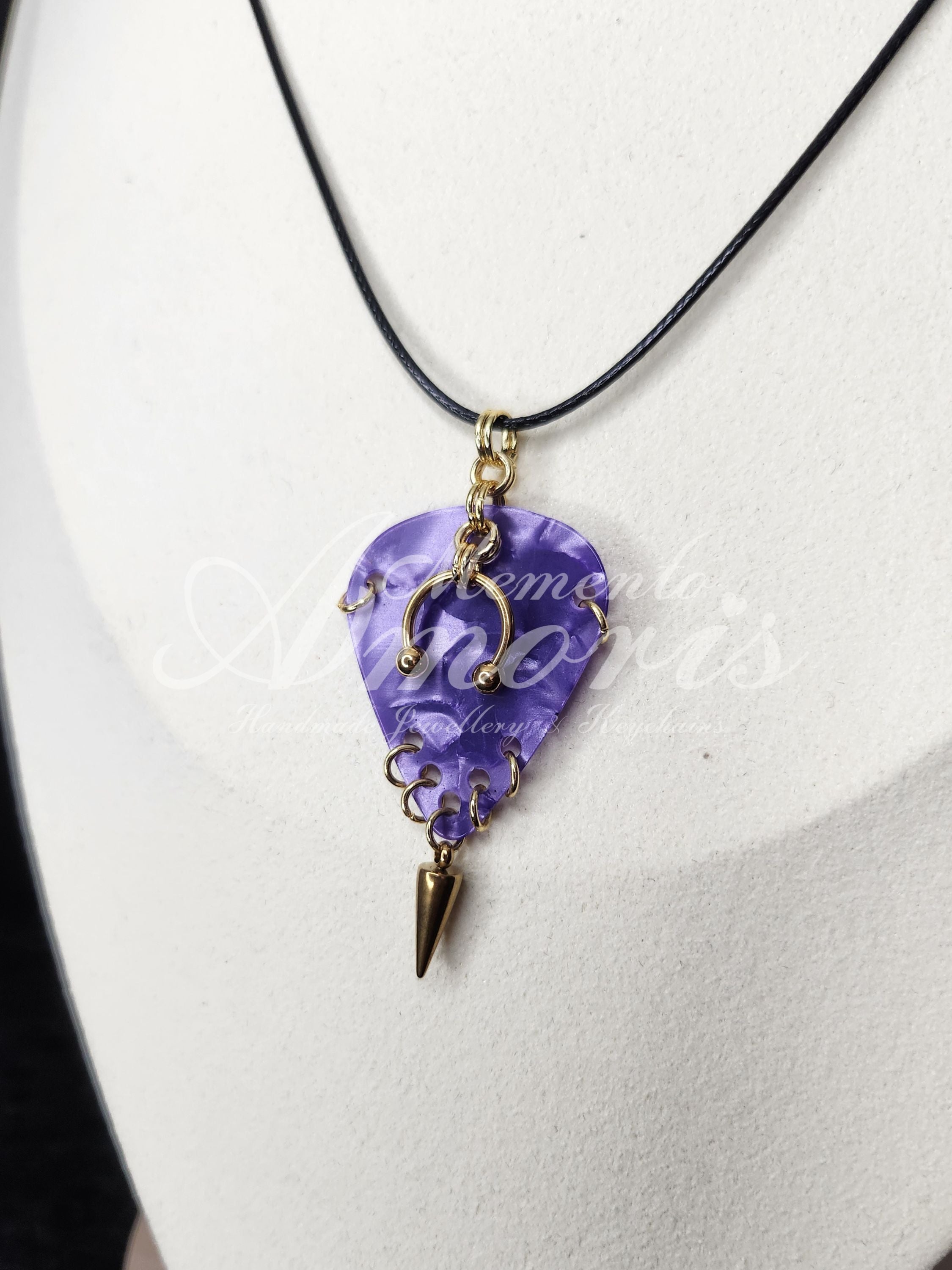 Plectrum Necklace 'Pierced and spiked' in purple, gold