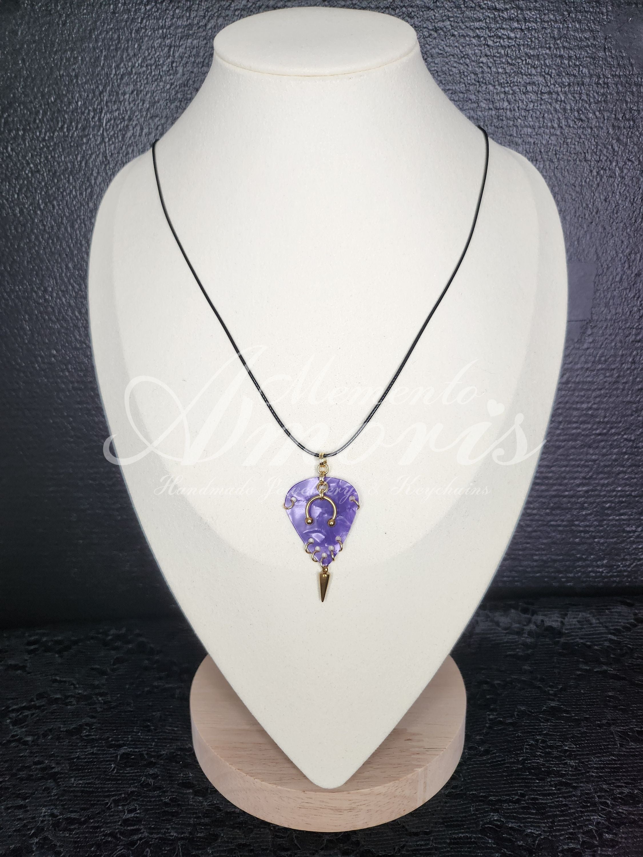 Plectrum Necklace 'Pierced and spiked' in purple, gold