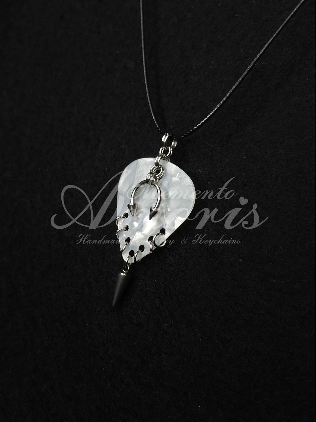 Plectrum Necklace 'Pierced and spiked' in white, silver