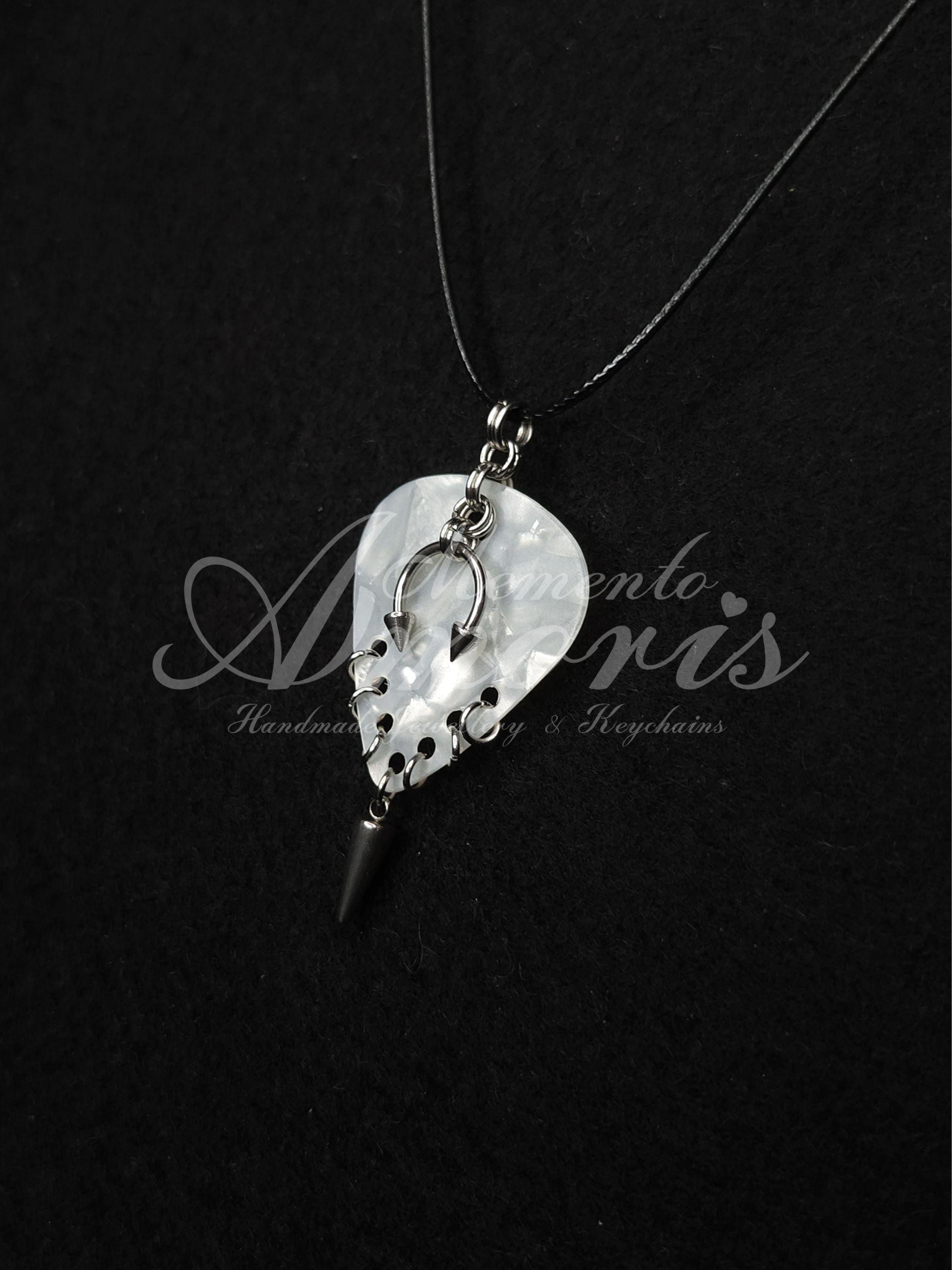 Plectrum Necklace 'Pierced and spiked' in white, silver