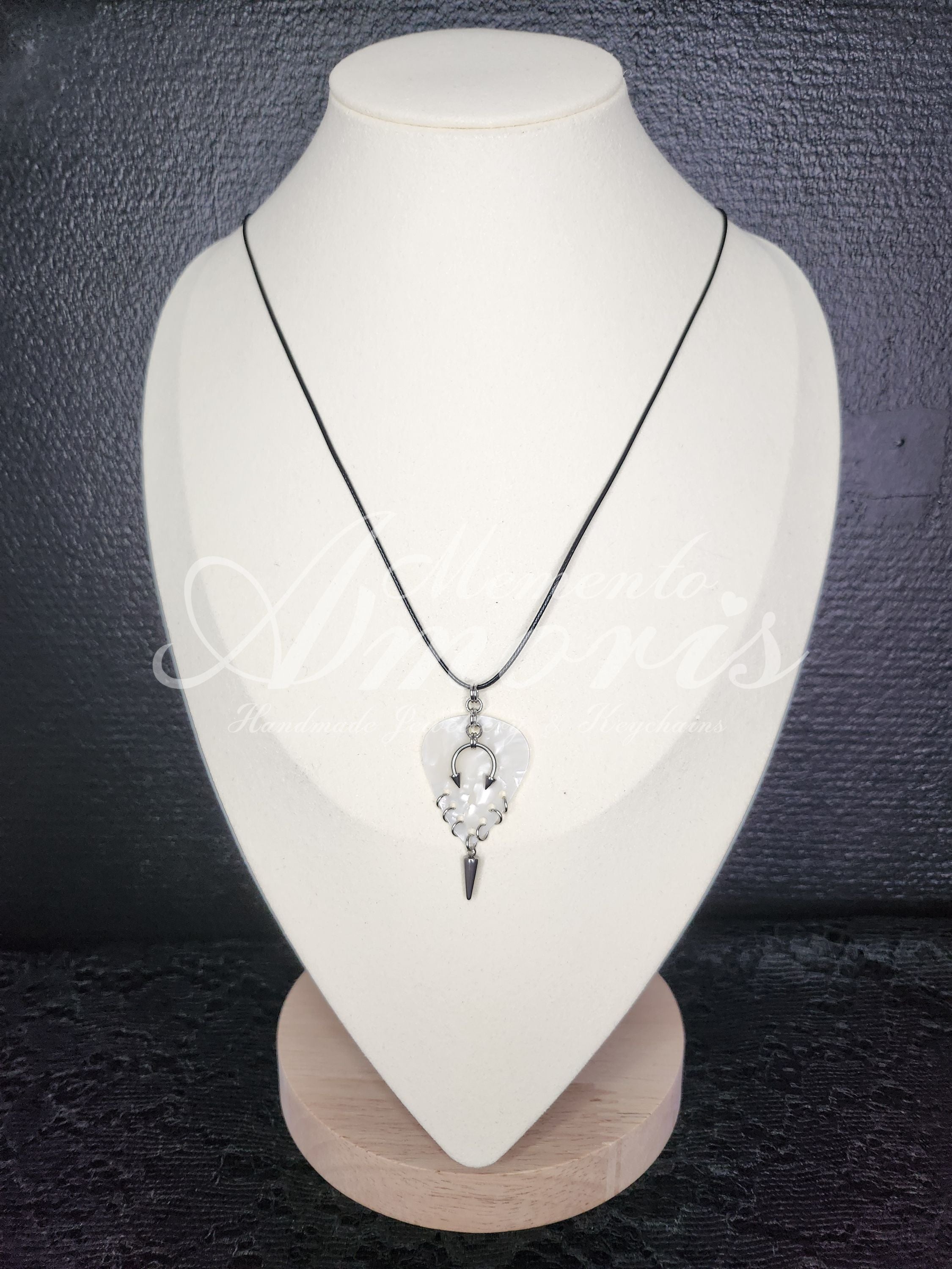 Plectrum Necklace 'Pierced and spiked' in white, silver
