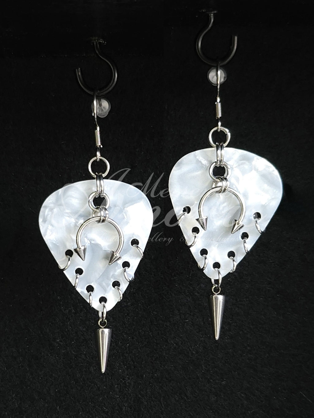 Plectrum Earrings 'Pierced and spiked' in white, silver