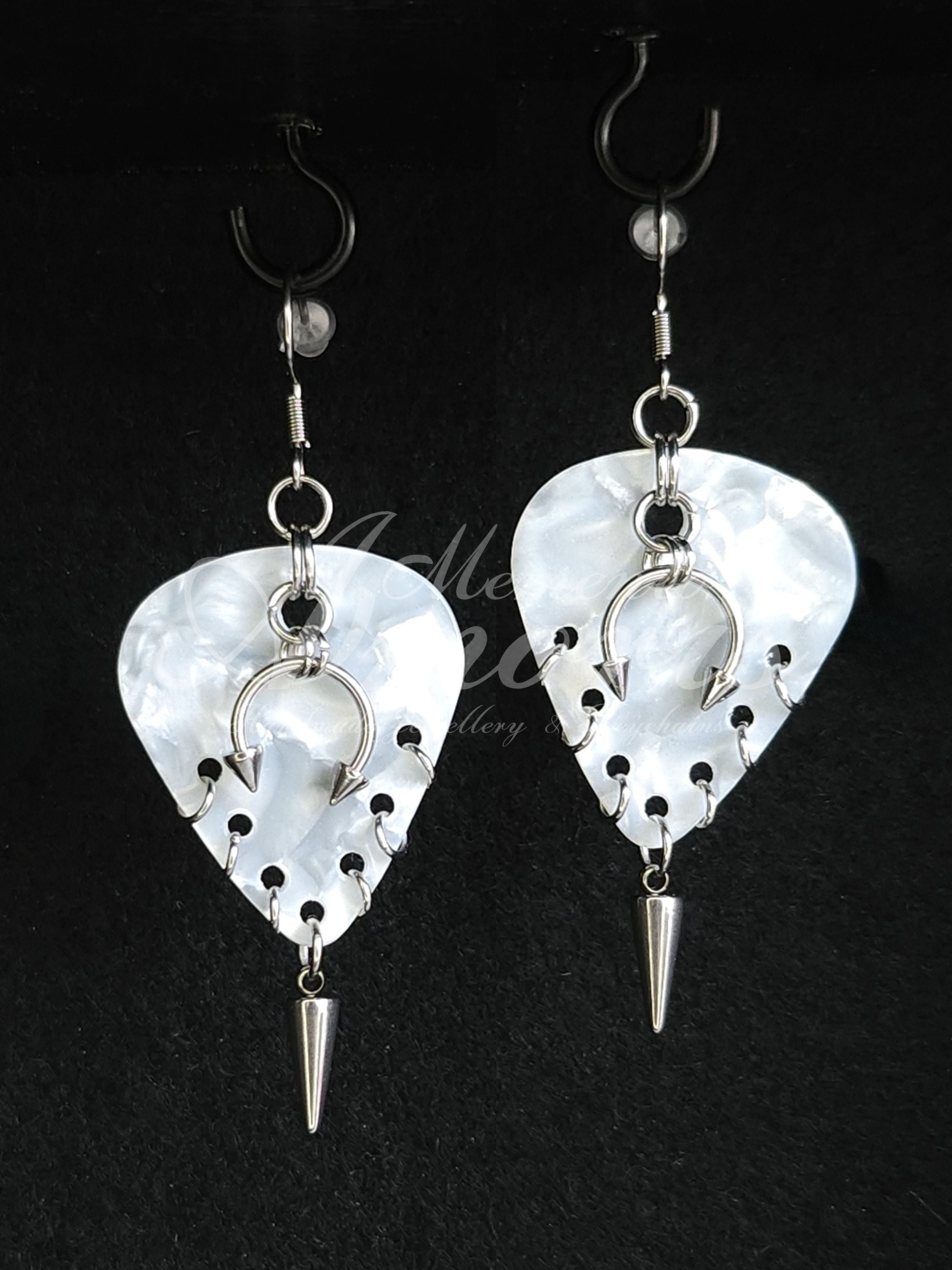 Plectrum Earrings 'Pierced and spiked' in white, silver