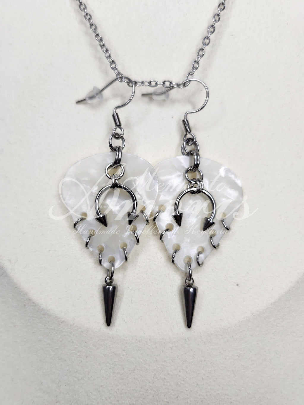 Plectrum Earrings 'Pierced and spiked' in white, silver