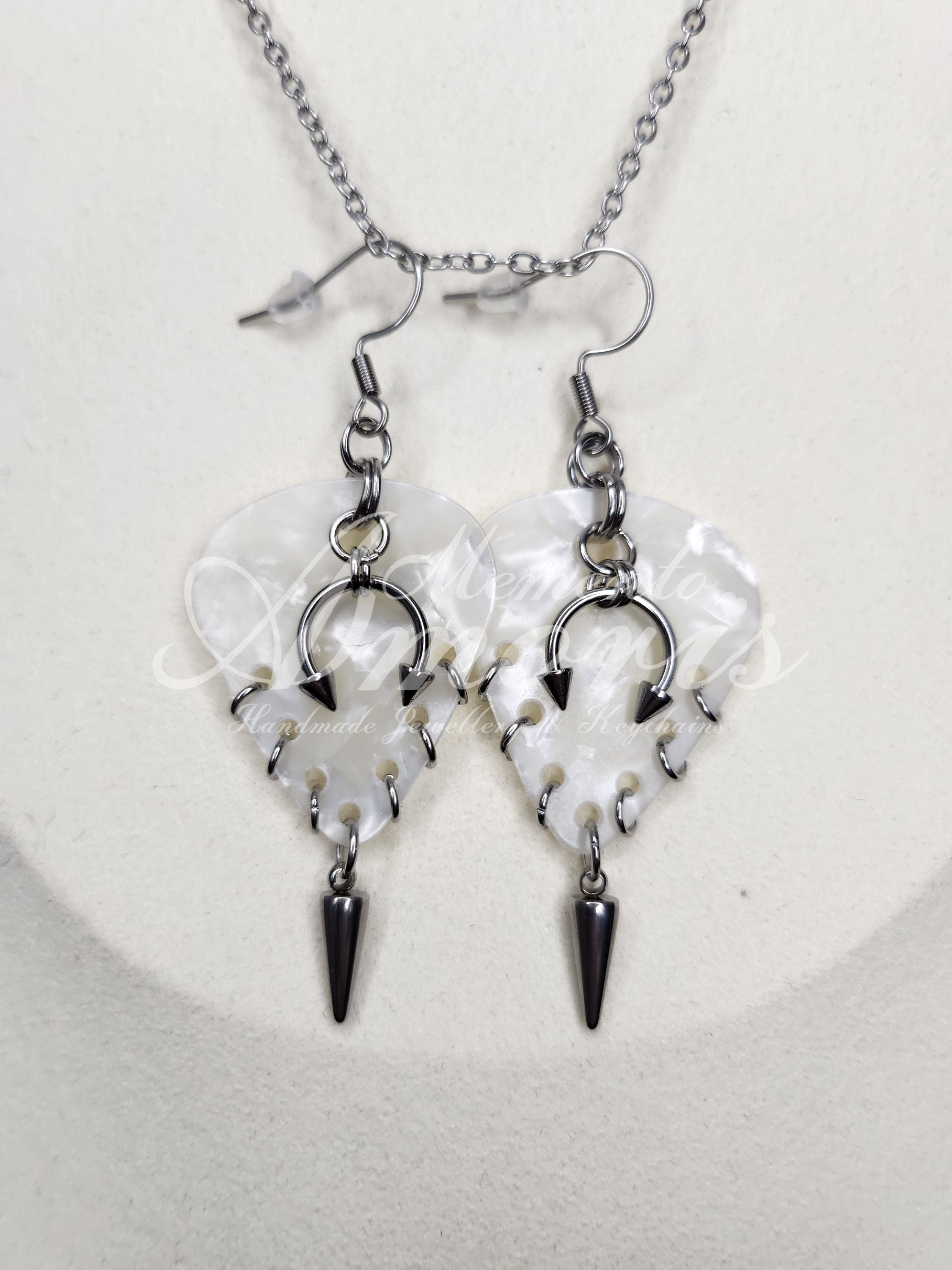 Plectrum Earrings 'Pierced and spiked' in white, silver